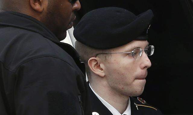 U.S. soldier Manning is escorted into court to receive his sentence at Fort Meade in Maryland