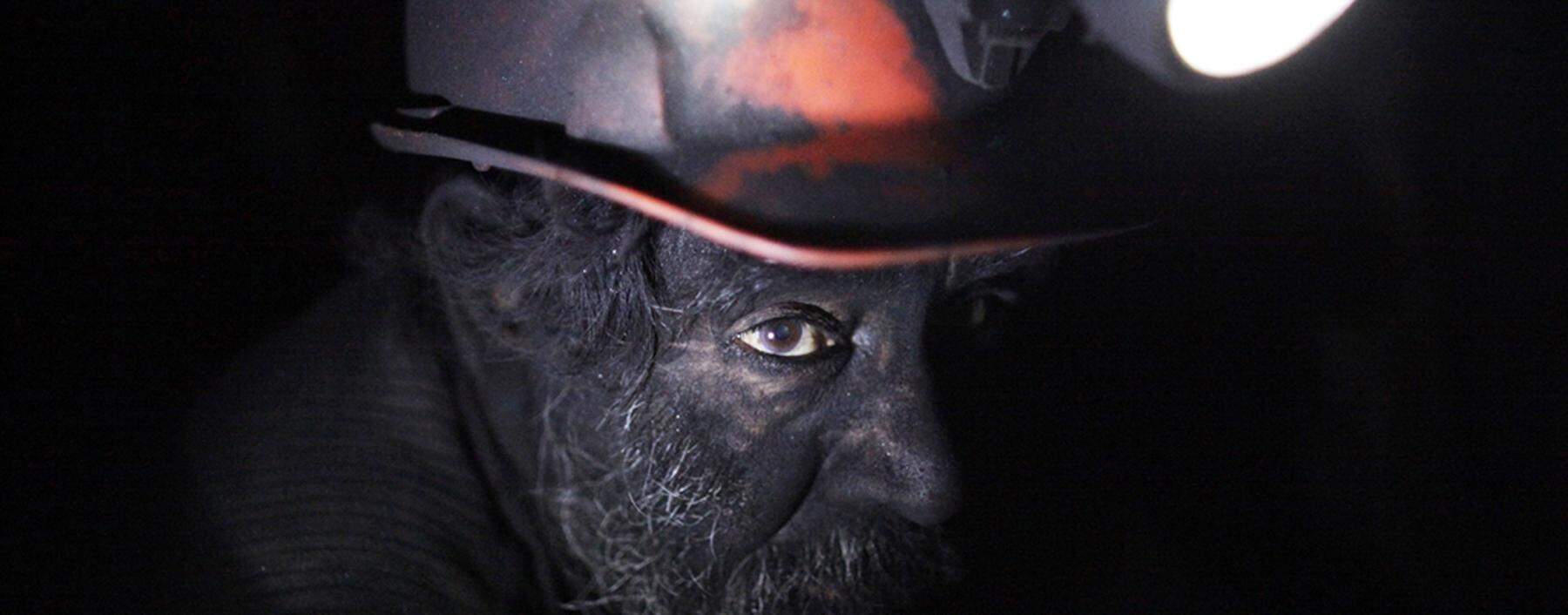 A miner takes a short break inside an unregulated coal mine in Sabinas