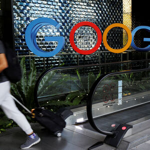 A man passes a Google signage outside their office in Singapore