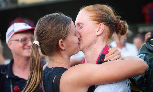 Belgian Alison Van Uytvanck and kisses her girlfriend Griet Minne after she won 7 5 2 6 and 1 6 a