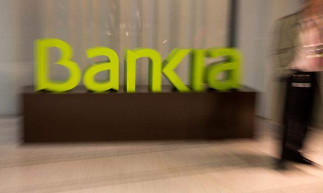 FILE PHOTO: Spain's Bankia logo is seen inside bank's headquarters before a news conference to present their annual results in Madrid