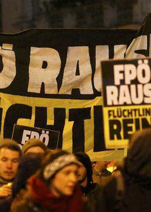 Protesters march as they demonstrate against Austrian Freedom Party´s (FPOe) Akademikerball ball in Vienna