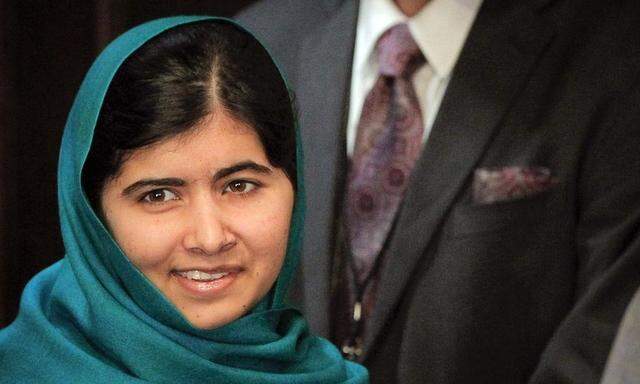 Pakistan's Malala Yousafzai arrives for a photo opportunity before speaking at an event in New York