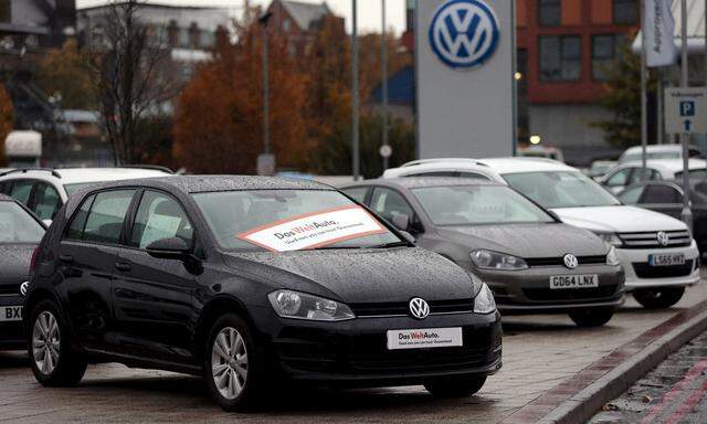 FILE PHOTO: Volkswagen cars are parked outside a VW dealership in London