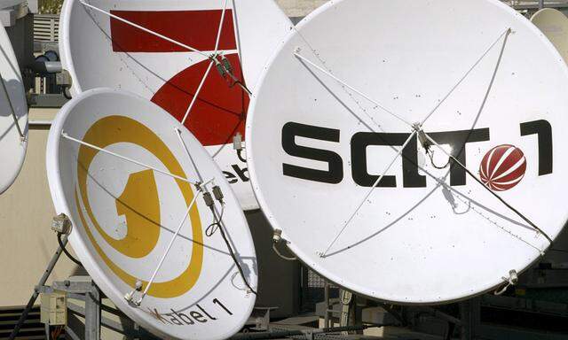 File photo of satellite dishes of the German television stations Kabel 1, SAT 1 and Pro Sieben on the roof of the company´s office in Berlin