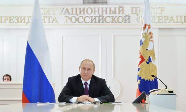 Russian President Vladimir Putin takes part in a video conference with members of Russian Geographical Society expedition to the Southern Pole in Moscow