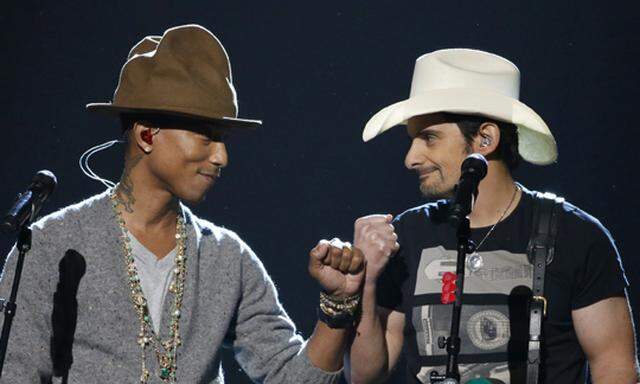 Pharrell and Paisley bump fists during the taping of ´The Night That Changed America: A Grammy Salute To The Beatles´  in Los Angeles