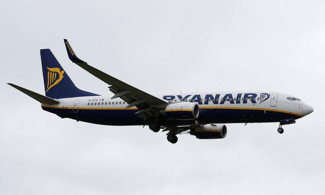 A Ryanair aircraft lands at Manchester Airport in Manchester