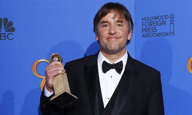 Richard Linklater poses with his award during the 72nd Golden Globe Awards in Beverly Hills