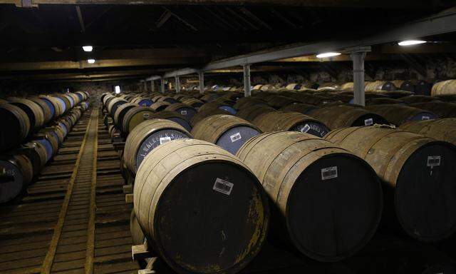 Whisky barrels are seen in the warehouse of the Diageo Cardhu distillery in Scotland