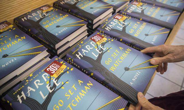Go Set a Watchman by Harper Lee hits the bookstores A customer chooses a copy of Go Set a Watchman