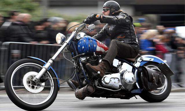 FILE PHOTO: A biker rides his Harley-Davidson during a parade at the 'Hamburg Harley Days' in Hamburg
