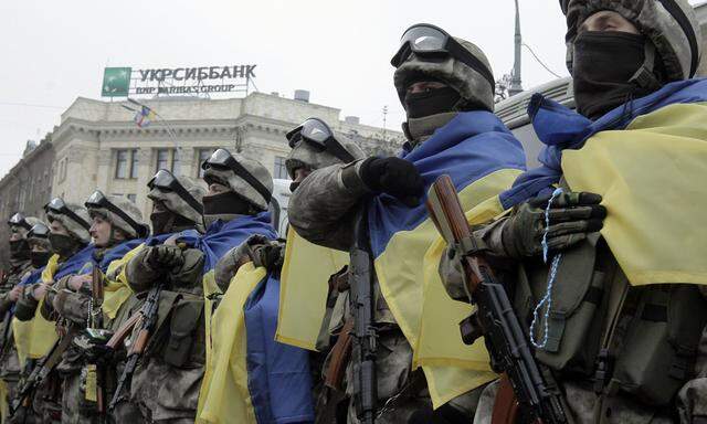 Members of a special unit of the Ukrainian armed forces line up before departing to take part in a military operation, during a farewell ceremony in Kharkiv