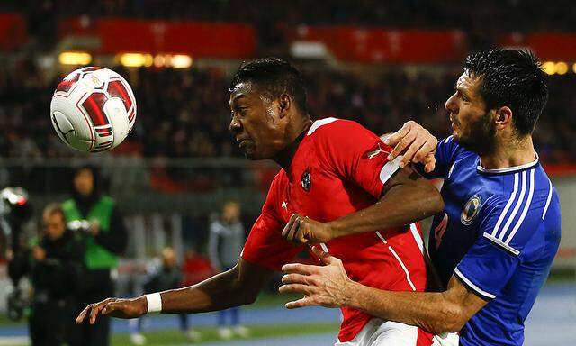Austria's Alaba challenges Bosnia and Herzegovina's Spahic during their international friendly soccer match in Vienna