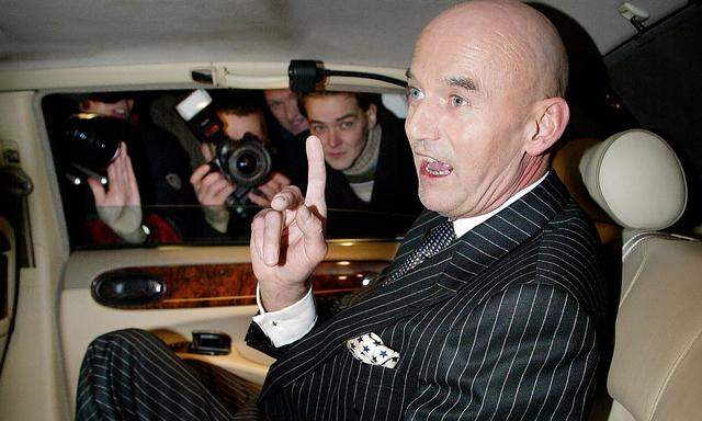 PIM FORTUYN SPEAKS TO PRESS FROM HIS BENTLEY IN A FILE PHOTO.