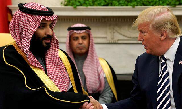 FILE PHOTO: U.S. President Trump shakes hands with Saudi Arabia's Crown Prince Mohammed bin Salman in the Oval Office at the White House in Washington