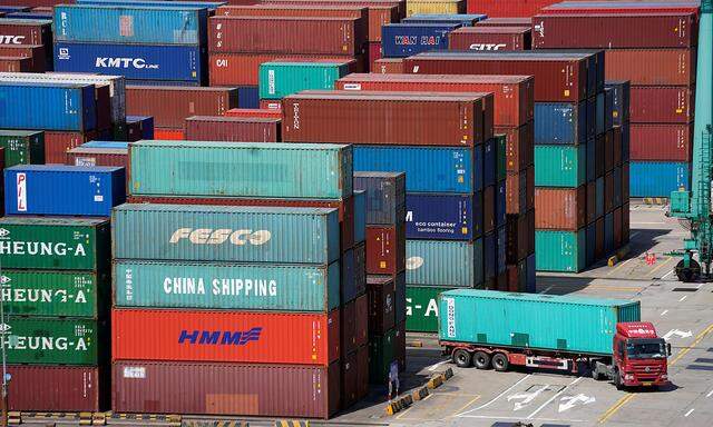 Shipping containers are seen at the port in Shanghai