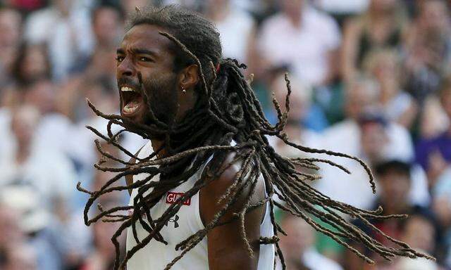 Brown of Germany celebrates a point during his match against Nadal of Spain at the Wimbledon Tennis Championships in London