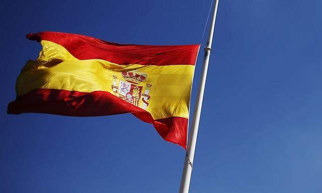 A Spanish flag flies half-mast at Colon Square, in central Madrid