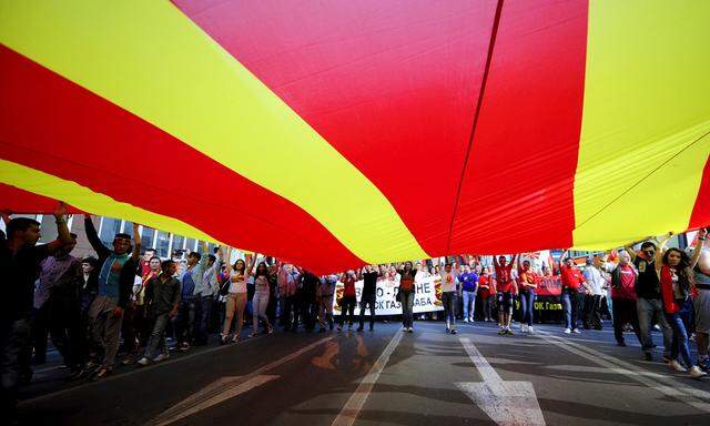 Supporters of the ruling VMRO-DPMNE party and Prime Minister Nikola Gruevski take part in a rally in Skopje