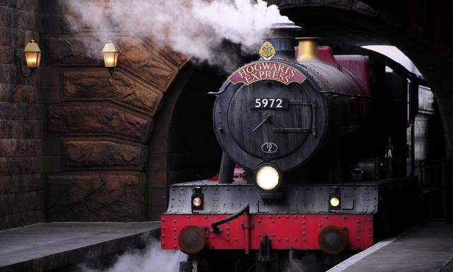 The Hogwarts Express train, which connects the Universal Studios with neighboring Islands of Adventure, pulls into the Hogsmeade Station during a media preview for The Wizarding World of Harry Potter-Diagon Alley at the Universal Orlando Resort in Orlando