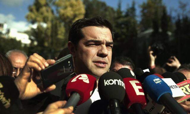 Tsipras, opposition leader and head of radical leftist Syriza party, talks to reporters outside the parliament building after the last round of a presidential vote in Athens