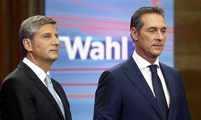 Austrian Vice Chancellor and head of the People's Party Spindelegger and leader of the Freedom Party Strache pose before for a TV debate after first projections in the Austrian general election in Vienna