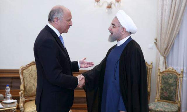 Präsident Rohani (re) begrüßt Außenminister Fabius