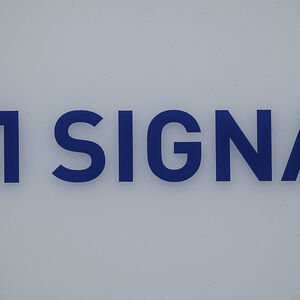 FILE PHOTO: A logo of Signa is pictured on a building nearby the Karstadt sport department store, in Berlin