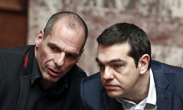 Greek PM Tsipras and Finance Minister Varoufakis talk during the first round of a presidential vote at the Greek parliament in Athens