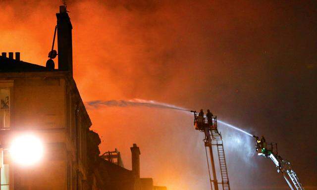 Firefighters attend to a blaze at the Mackintosh Building at the Glasgow School of Art, which is the second time in four years, Glasgow, Scotland, Britain