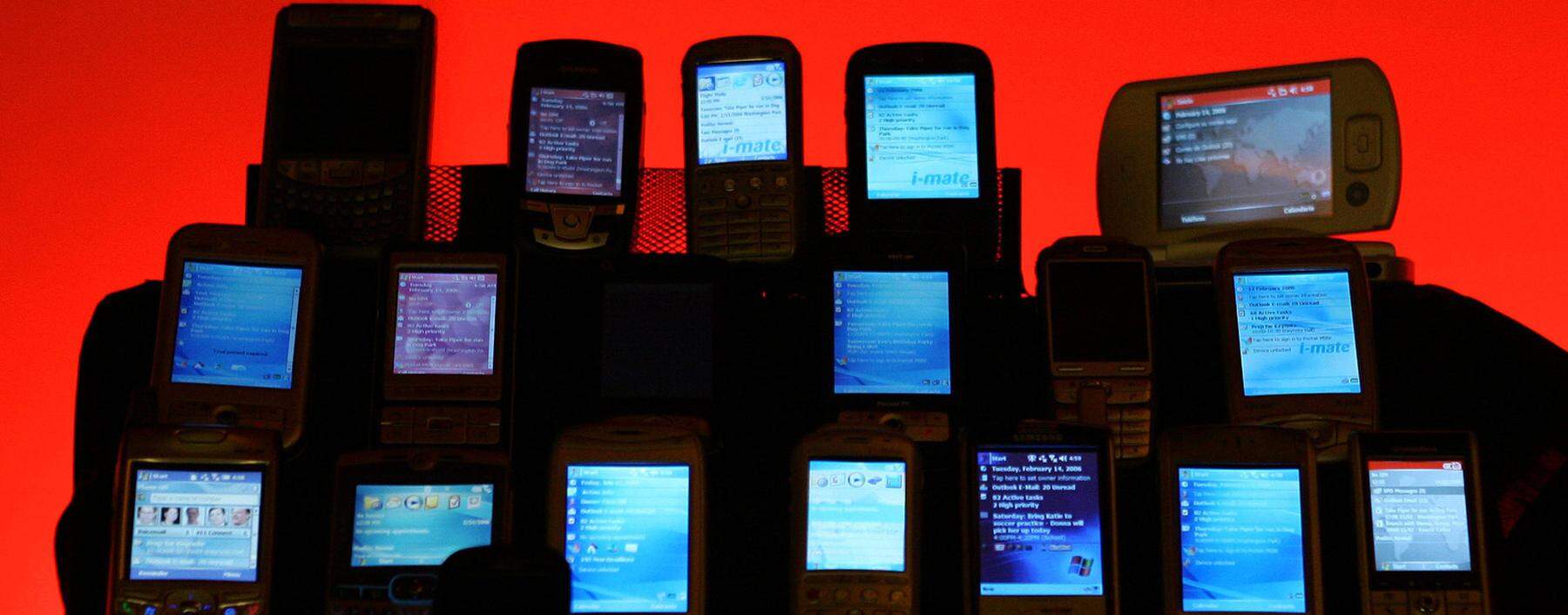 Phones and hadsets are displayed at the 3GSM World Congress in Barcelona