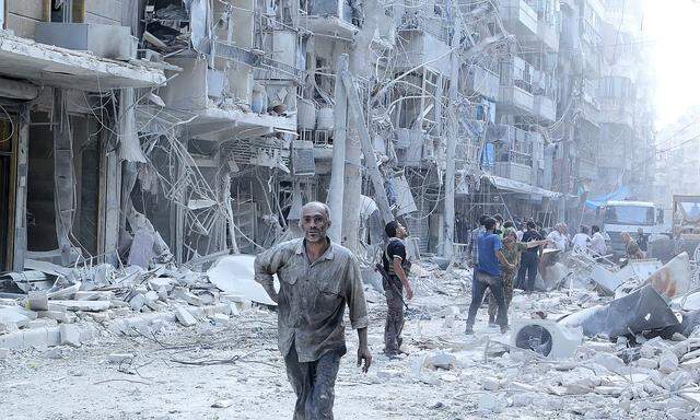 Die Suche nach Überlebenden nach einem Fassbomben-Angriff in Aleppo.