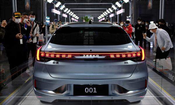 FILE PHOTO: Visitors check a Zeekr 001, a model from Geely's new brand Zeekr, at its factory in Ningbo