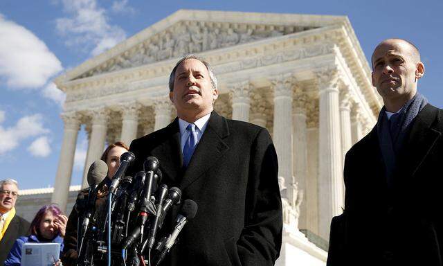 FILE PHOTO: Texas Attorney General Ken Paxton addresses reporters on the steps of the U.S. Supreme Court in Washington