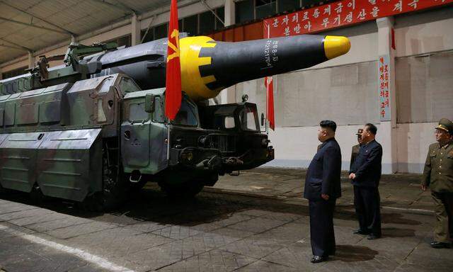 North Korean leader Kim Jong Un inspects the long-range strategic ballistic rocket Hwasong-12 (Mars-12)