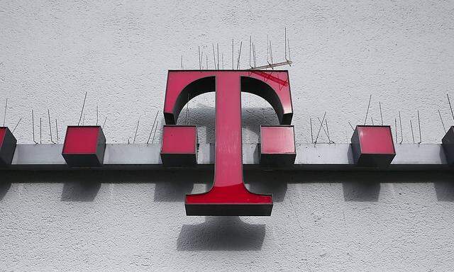 Spikes against doves are placed on the logo of German telecommunications giant Deutsche Telekom AG at a Telekom mobile phones store in the city centre of the western German city of Koblenz