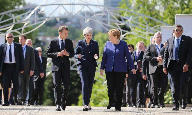Die EU-Chefs Macron, May und Merkel (v. l.) wollen den von Trump gekündigten Iran-Deal retten.