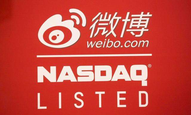 Signage for Weibo Corporation is seen at the NASDAQ MarketSite in Times Square on day one of its initial public offering (IPO) on The NASDAQ Stock Market in New York