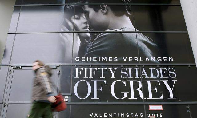 A pedestrian walks past advertisment for film ´Fifty Shades of Grey´  in Berlin