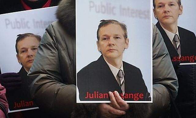 Ukrainian activists hold a rally in support of WikiLeaks founder Julian Assange in front of the Swedi