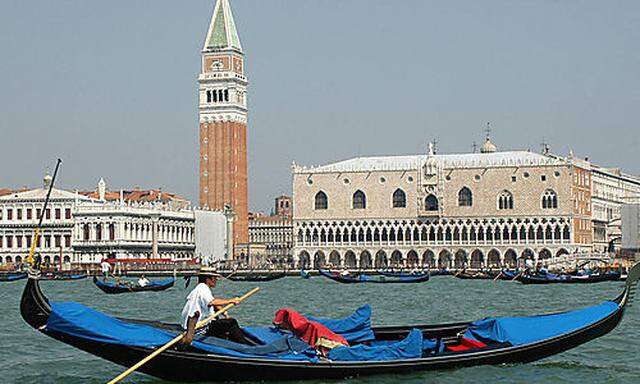 Gondolas engage the waters in front of Venice's St. Mark's Square, northern Italy, Friday, July 23, 2