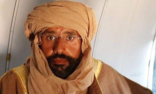 File photo of Saif al-Islam Gaddafi seen sitting in a plane in Zintan