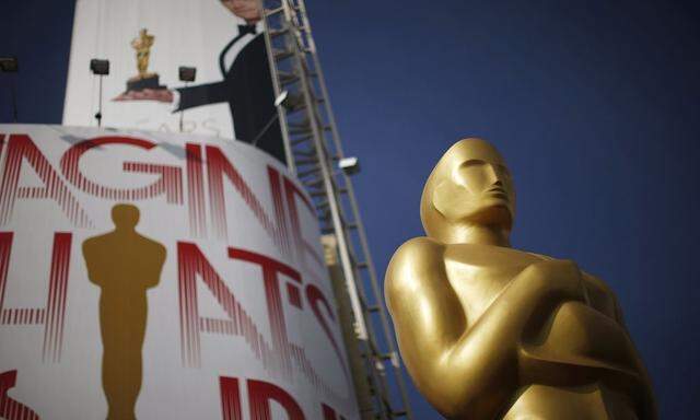 An Oscar statue is seen outside the Dolby Theater during preparations ahead of the 87th Academy Awards in Hollywood