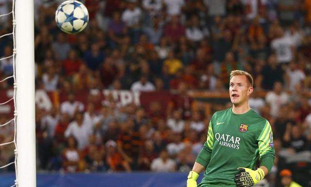 AS Roma's Florenzi shoot and score as Barcelona's goalkeeper Stegen looks on during their Champions League match at the Olympic stadium in Rome