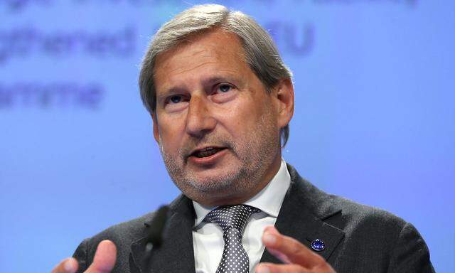 FILE PHOTO: European Commissioner for Budget and Administration Johannes Hahn holds a news conference in Brussels