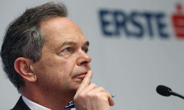 Treichl, CEO of Austrian lender Erste Group, listens during a news conference in Vienna