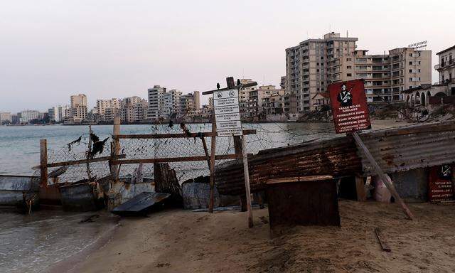 Varosha, an area fenced off by the Turkish military since the 1974 division of Cyprus, is seen from a beach in Famagusta