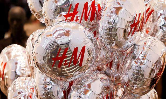 FILE PHOTO:Balloons with the logo of Swedish fashion retailer H&M are pictured at its newly opened store in central Moscow