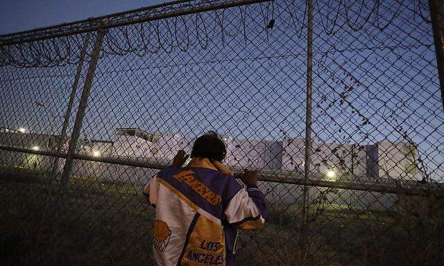 An inmate's family member stands outside the Topo Chico prison in Monterrey